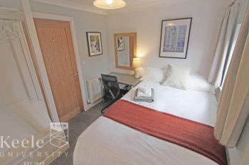 Bedroom 3 - double bedroom with a double divan bed, wall mounted LED Tv, bedroom furniture (wardrobe storage / drawers/dresser / desk + study chair)